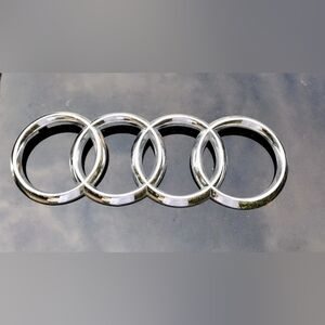 Audi Q7 front grill OEM emblem chrome from 1st Gen 2005-2015 models.